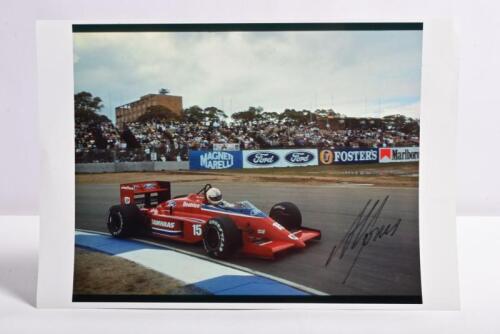 JONES: A colour picture of Alan Jones racing a Beatrice Lola Ford THL2 at the 1986 Australian Grand Prix, Adelaide. Picture signed by Alan Jones