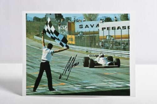 JONES: A colour picture of Alan Jones racing a Williams FW07. Alan Jones signature