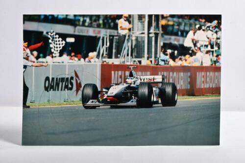 HAKKINEN: A colour picture of Mika Hakkinen racing the McLaren Mercedes-Benz at the Australian Grand Prix, Melbourne. Mika Hakkinen signature