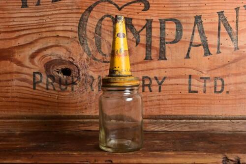 FIREZONE: An early small oil bottle with "HG Sleigh Firezone" tin pourer