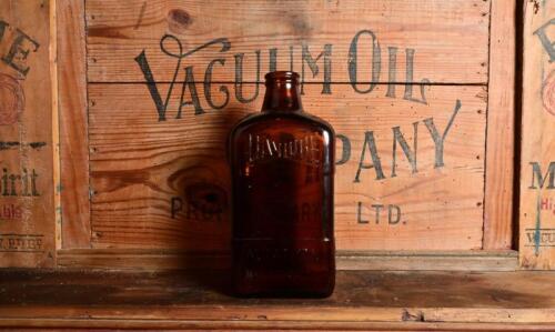 DAYLUBE: An original "Daylube Aviation Motor Oil" one imperial quart brown glass bottle