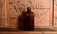 DAYLUBE: An original "Daylube Aviation Motor Oil" one imperial quart brown glass bottle