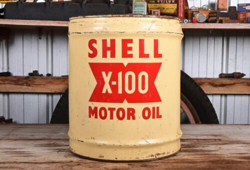 SHELL: A circa 1950s four gallon Shell X-100 motor oil drum with embossed lid, bottom rusty