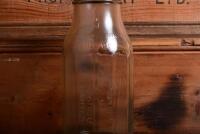 CASTROL: A circa 1950/60s "Castrol" one quart oil bottle, with circa 1950/60s Castrol CW 30-40 MS" tin pourer and dust cover - 5