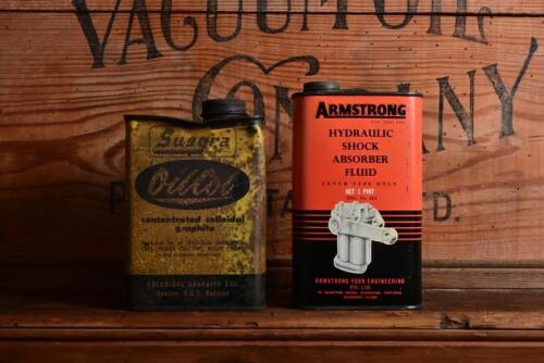TINS: Two vintage Australian tins, "Armstrong Hydraulic Shock Absorber Fluid" one pint tin and OilCol Concentrated Colloidal Graphite" twelve pound tin