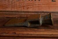 SHELL: A rare and early brass embossed hammer head for drum opening, 14.5cm wide - 2