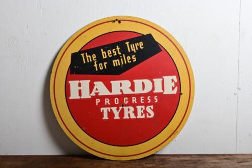 HARDIE TYRES: A circa 1960s "Hardie Progress Tyres, The Best Tyre for Miles" sign printed on masonite, marked to lower right margin"AT16", 41.5cm diameter
