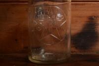 TEXACO: A mid 20th century "Texaco" embossed one quart oil bottle, with original mid 20th century "Texaco 40" tin pourer and dust cover, with rivet air hole - 2