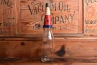 TEXACO: A mid 20th century "Texaco" embossed one quart oil bottle, with original mid 20th century "Texaco 40" tin pourer and dust cover, with rivet air hole - 4