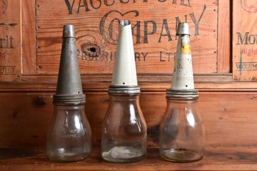 OIL POURERS: A half litre and two pint oil bottles with tin pourers, including Shell