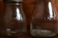 OIL POURERS: A half litre and two pint oil bottles with tin pourers, including Shell - 8