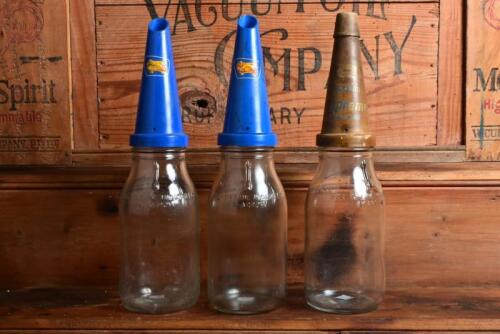 GOLDEN FLEECE: Three one litre oil bottles with plastic "Golden Fleece" pourers