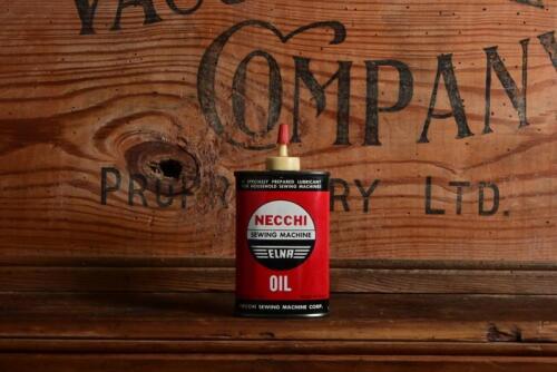 NECCHI: An original American "Necchi Sewing Machine" three fluid ounce oil tin, with contents