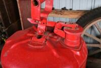 VACUUM OIL CO: A red painted unbranded petrol can with a circa 1930s Mobiloil tap, together with a a copper painted oil can, largest 41cm high - 5