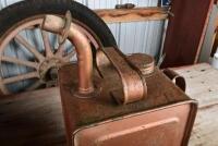 VACUUM OIL CO: A red painted unbranded petrol can with a circa 1930s Mobiloil tap, together with a a copper painted oil can, largest 41cm high - 6