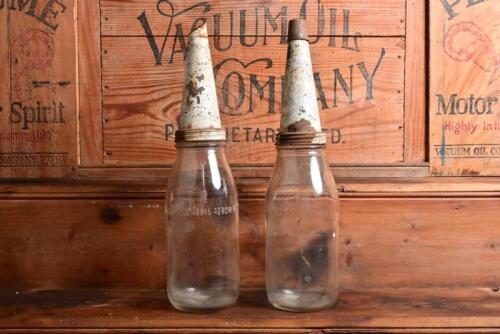 OIL POURERS: Two imperial quart oil bottles with tin pourers, including Mobil