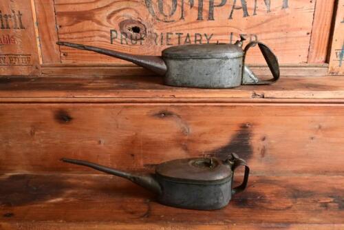 REGA: Two mid 20th century galvanised steel "Rega" oil cans, a pint and a half pint can, longest 41cm long
