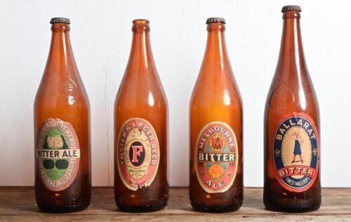 BEER BOTTLES: Four vintage long neck beer bottle with labels, comprising Victoria Bitter, Bitter Ale", "Ballarat Bitter", "Melbourne Bitter Ale" and "Fosters Lager Beer"