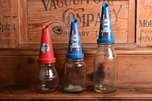 ESSO: Three post 1960 plastic pourers on various bottles, comprising a one litre, five hundred millilitre and another unmarked jar