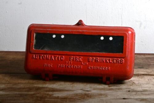 FIRE SPRINKLERS: A red painted wasl mounted cast iron embossed "Automatic Fire Sprinklers" box, 32cm wide