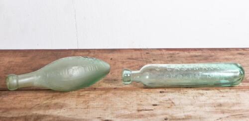 TORPEDO BOTTLES: Two antique embossed Hamilton (Torpedo) green aqua glass bottles, including "Rowland's & Lewis" longest 27cm