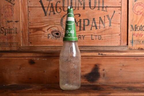 CASTROL: A one imperial quart oil bottle, with mid-late 20th century "Castrol CW 30-40 MS" tin pourer and dust cover