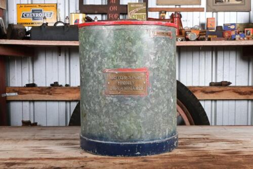 FUEL DRUM: An early galvanised steel five gallon petrol drum, bears brass plaque "Motor Spirit Highly Flammable" and a "5 Gallon Line" marker