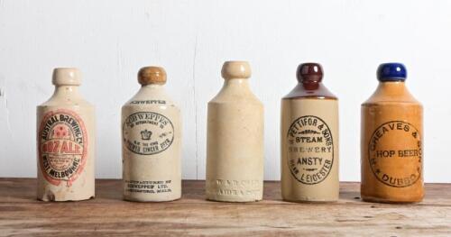 CERAMIC BOTTLES: A collection of five ceramic beer bottles, including Greave's Son, Dubbo