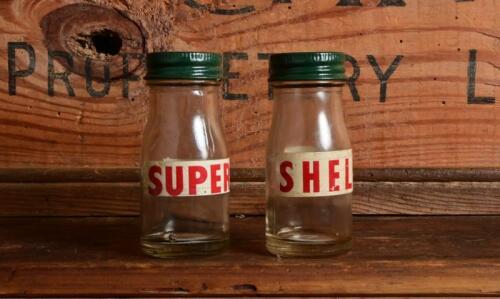 SHELL: A pair of small circa 1950/60s "Shell" oil bottles, "Supershell" and "Shell X-100"