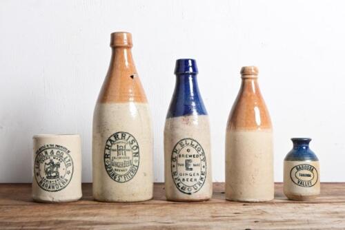 CERAMIC BOTTLES: A collection of four ceramic beer vessels, including "R. Harrison Spring, Fitzroy", the R. Harrison and GH Elliott bottles have been repaired