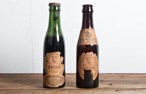 GUINNESS: Two 19th century "Foreign Guinness Extra Stout" bottle with labels, exported by E&J Burke of Dublin, one unopened with contents