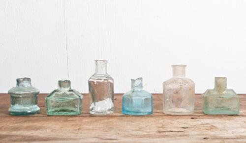INK BOTTLES: A collection of six vintage ink bottles, including "Windsor Newton", tallest 8cm high