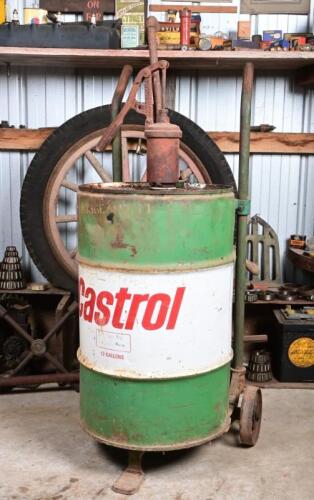 CASTROL: A 1960-90s thirteen gallon oil drum and hand pump with an adjustable oil drum trolley