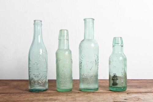 CORDIAL BOTTLES: A collection of four antique cordial bottles, including "Emil Resche, Broken Hill", tallest 23cm high