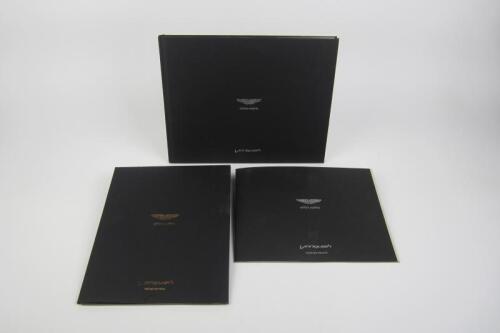 VANQUISH: A group of three Aston Martin Vanquish sales brochures.