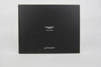 VANQUISH: A group of three Aston Martin Vanquish sales brochures. - 2