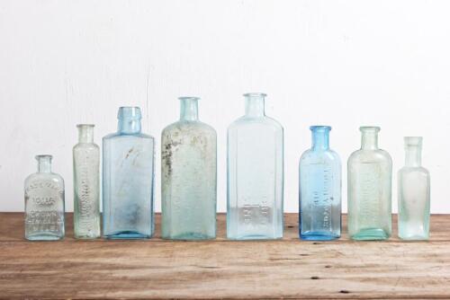CHEMIST BOTTLES: A collection of eight antique chemist's bottles, including "W Johnson & Son, St Kilda"