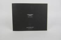 VANQUISH: A group of three Aston Martin Vanquish sales brochures. - 8