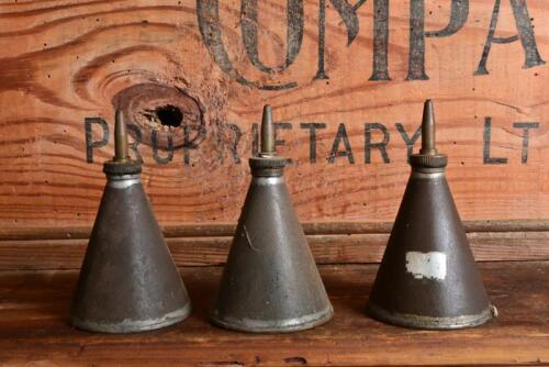REGA: Three early "Rega" conical oilers, 10cm high