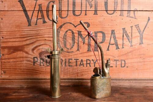 BURNERS: Two antique brass burners, one with rural farming scene, largest 23.5cm high
