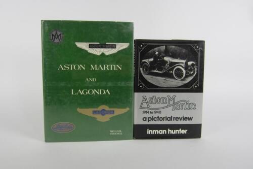 ASTON MARTIN/LAGONDA: Two hardcover books detailing the history of Aston Martin/Lagonda.