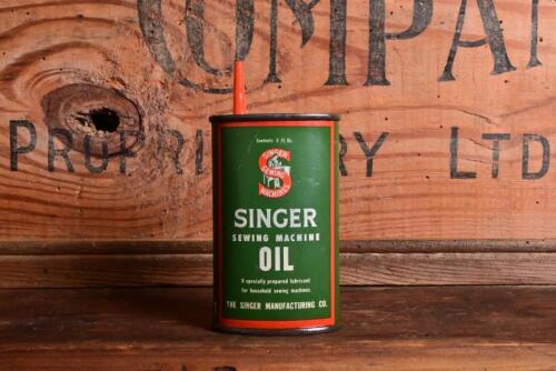 SINGER: A three ounce Singer Sewing Machine Oil tin