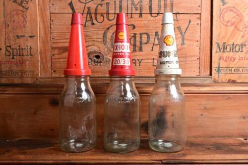 SHELL: Three litre oil bottles, with plastic "Shell" pourers and dust covers