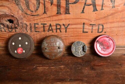 LIDS: Four various oil caps, one embossed Shell (red), brass 'A.A O Co. Ld' and 1920s Citroen 'Huile Gargoyle Mobiloil "BB"'