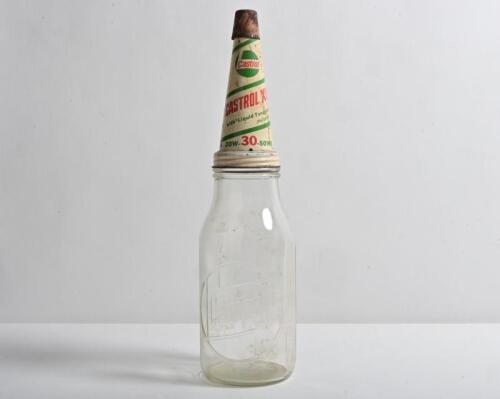 CASTROL: A circa 1960s "Castrol" embossed one quart oil bottle, with circa 1970/80s "Castrol XL 20W-30-50MS" tin pourer and dust cover