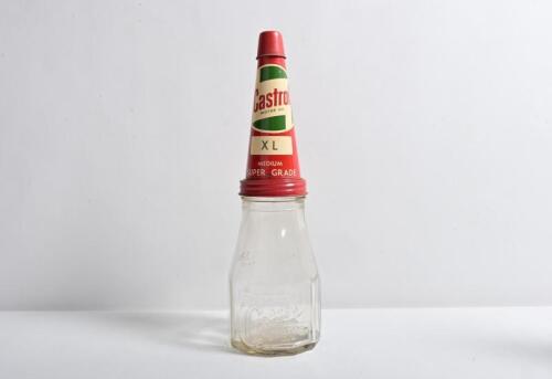 CASTROL: A circa 1940/50s "Castrol Wakefield" embossed one imperial pint bottle, with circa 1960s "Castrol XL Medium Super Grade" tin pourer and dust cover