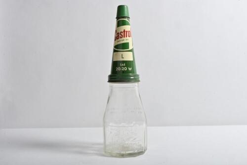 CASTROL: A circa 1940/50s "Castrol Wakefield" embossed one imperial pint oil bottle with circa 1960s L SAE 20-20 W tin pourer and dust cover