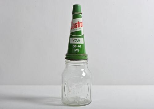CASTROL: A 1960s "Castrol" embossed one pint oil bottle, with circa 1960s "Castrol CW 30-40 MS" pourer with lid