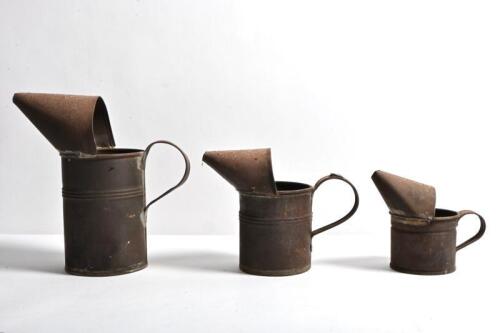 OIL POURERS: Three rustic oil pourers in graduating sizes, largest 22cm high