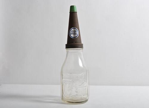 CASTROL: A circa 1940/50s "Castrol Wakefield" embossed one imperial quart oil bottle, with later 10-30 special tin pourer and lid